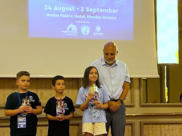 Young award recipients holding their trophies