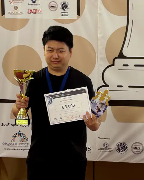 The tournament winner with his trophy and prize